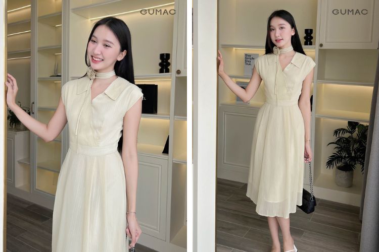 Đầm màu kem&nbsp;đắp chéo kèm theo hoa đeo cổ