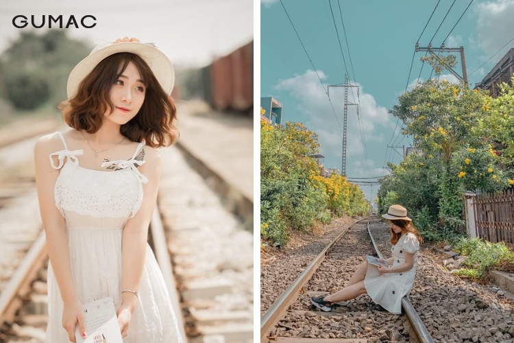 Diện váy đầm trắng tinh khôi tạo dáng cùng ga tàu